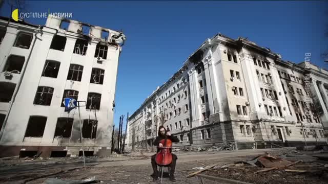 A man is playing a cello in the Kharkiv,city center,Ukraine