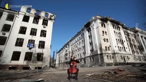 A man is playing a cello in the Kharkiv,city center,Ukraine