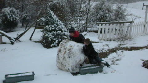 1/2011 - Blake and Dylan rolling snow