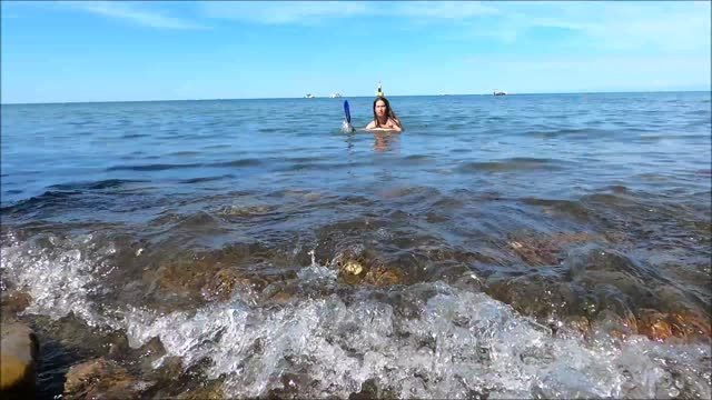 A Woman Diving in the Ocean