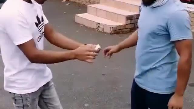 Slapping people and give them money by some one