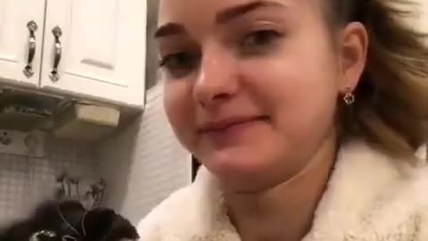 Beautiful girl joking with her cat