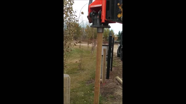 Pole-Cat Installing Driveway Fence