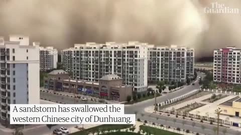 Dramatic moment sandstorm swallowing Chinese city Dunhuang