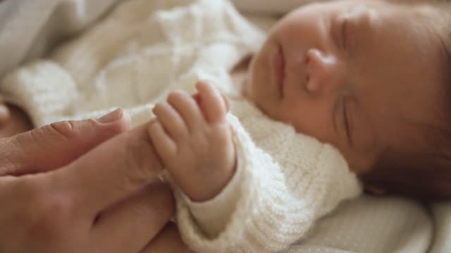 A NewBorn Baby Holding The Finger Of Mother So Adorable video