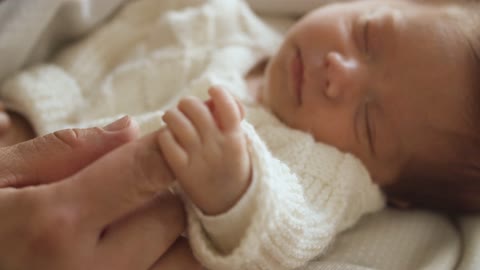 A NewBorn Baby Holding The Finger Of Mother So Adorable video