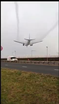 A plane flying through there cloud