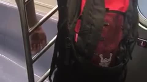 Nsfw red backpack pees on subway seat