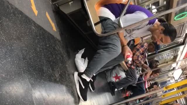 Man pony tail whip cream subway train