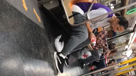 Man pony tail whip cream subway train