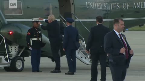 Trump_stops_to_retrieve_Marine's_hat(720p)