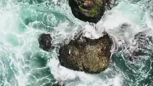 birds-eye-view-of-crashing-waves-on-the-rock