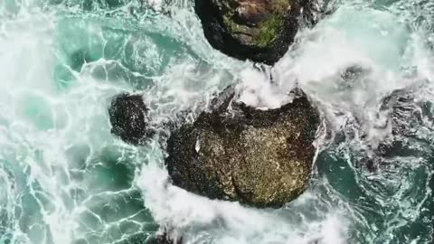 birds-eye-view-of-crashing-waves-on-the-rock