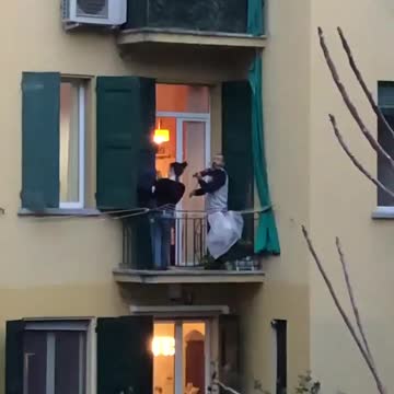 Balcony entertainment in Bologna taking ease off quarantine