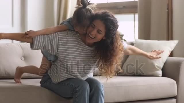 Happy family loving young mum playing piggybacking cute little funny