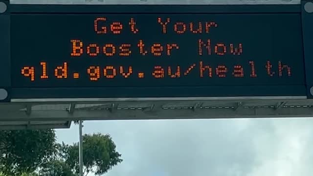Dave Oneegs Ute Chat. Roadside with a Covid Billboard.