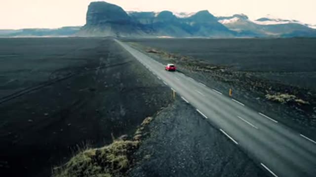 Car Driving Through Icelandic Landscape