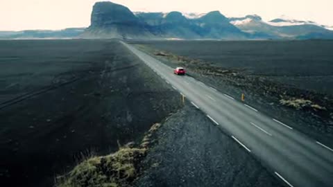 Car Driving Through Icelandic Landscape