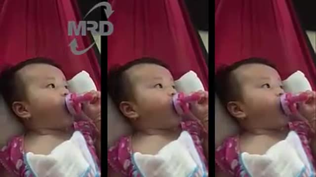 Baby drinking bottle milk - 3 months old