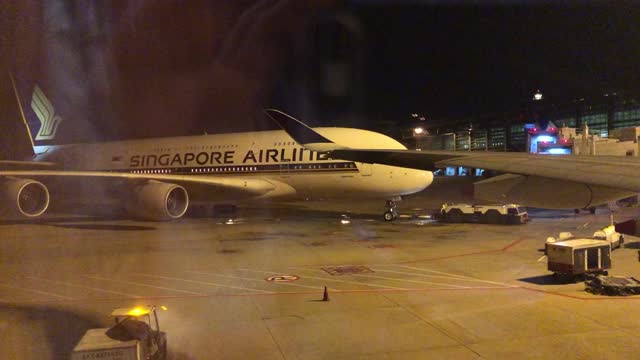 Parking a large plane at the airport at night