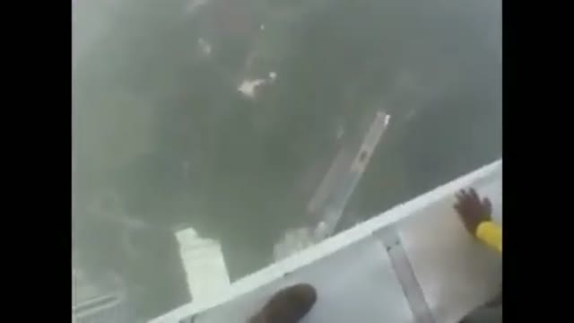 Walking on the Edge of a Tall Building, This Man Slipped and Ended Tragically