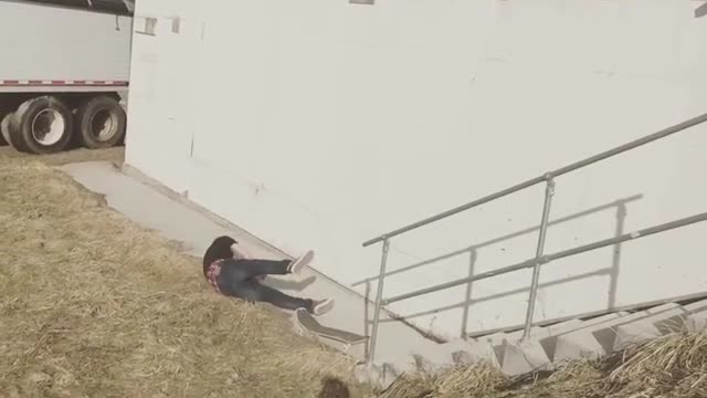 Skater rail trick lands breaks board