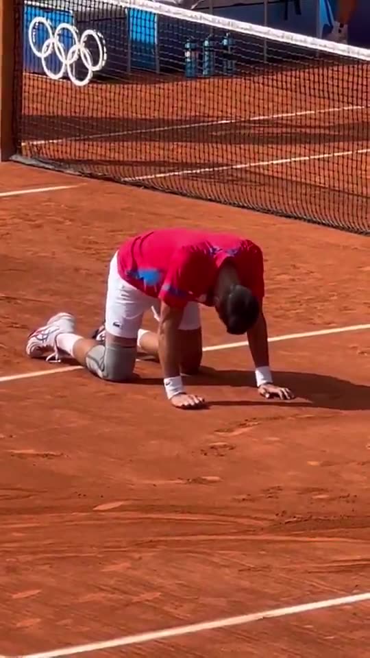 Novak Djokovic, a devout Orthodox Christian, gets down on his hands and knees to thank God