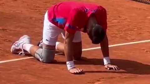 Novak Djokovic, a devout Orthodox Christian, gets down on his hands and knees to thank God