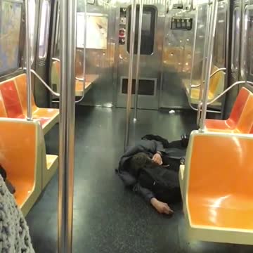 Man in all black passed out on floor
