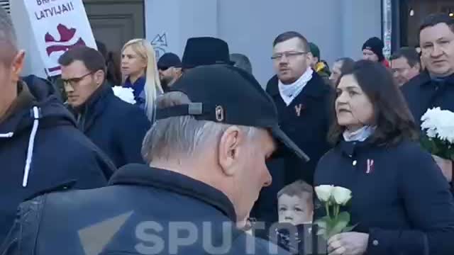 Latvian SS legionnaires hold a traditional procession in Riga