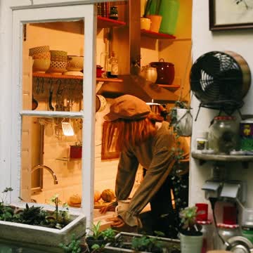 Young Woman Having Coffee on Kitchen Counter