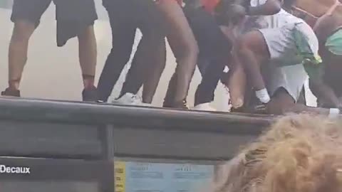 Migrants smash bus shelter while twerking at Notting Hill Carnival.