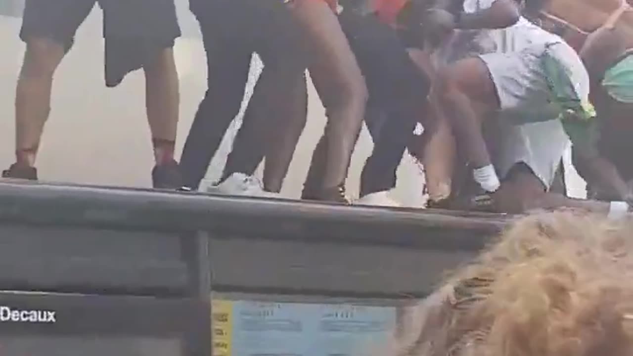Migrants smash bus shelter while twerking at Notting Hill Carnival.
