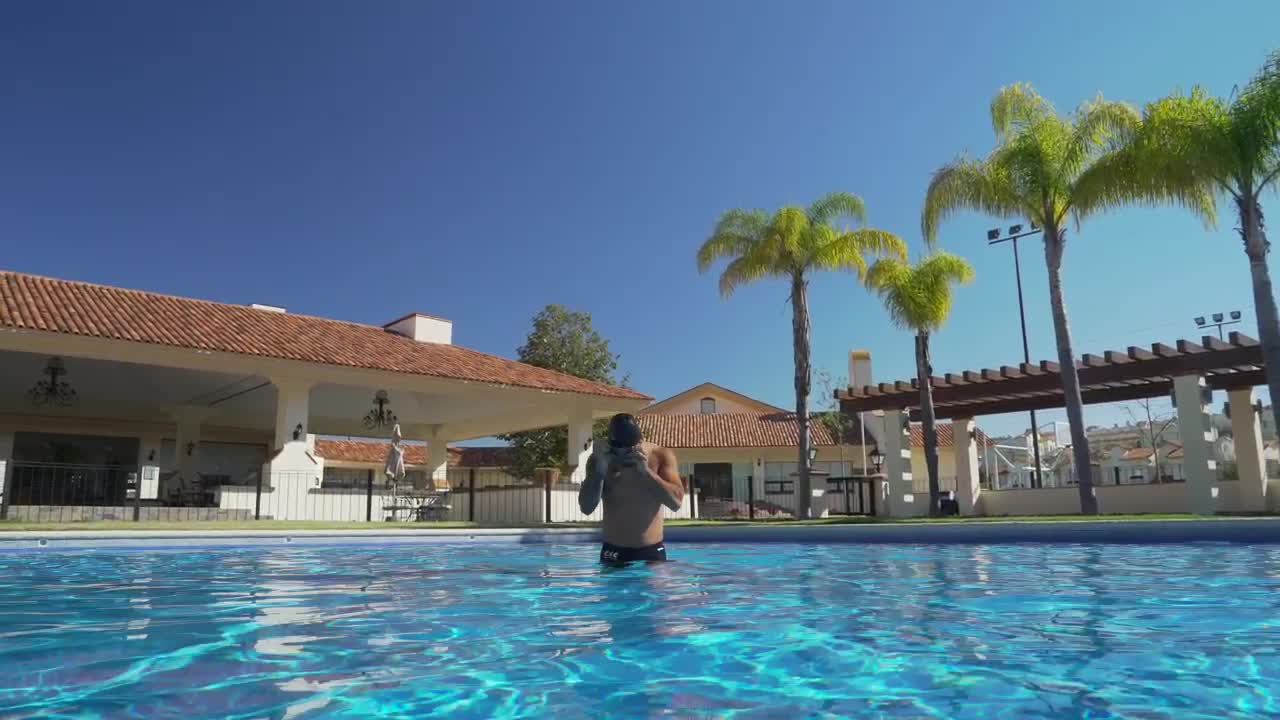 A man prepares to swim