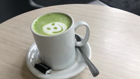 A smiled yummy green tea latte