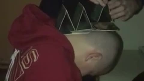 Stacking cards on passed out guys head