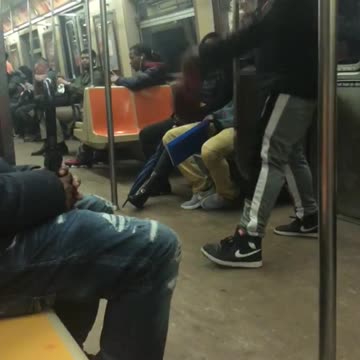 Guy does a contemporary dance on subway train