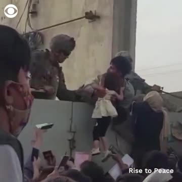 Babies and children are being pulled over the wall by U.S.