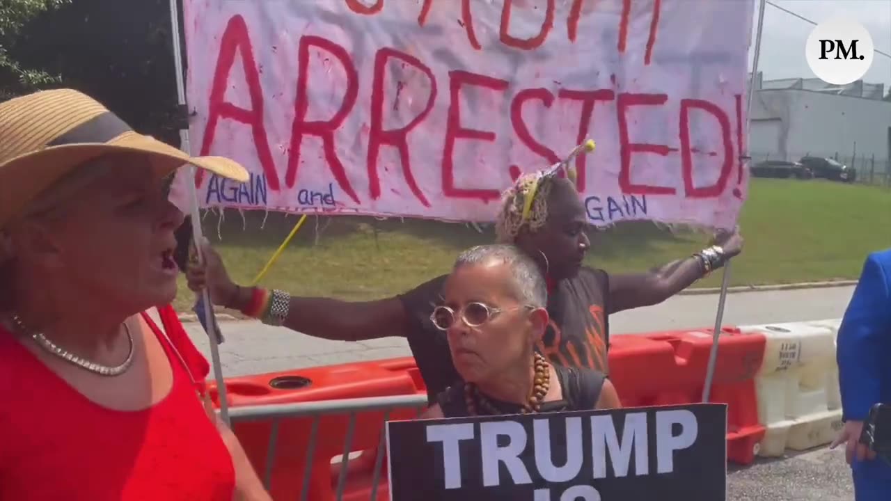 Trump Supporters Show Their Support, Verbally Clash With Protestors Outside Fulton County Jail