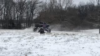 Monster Truck Doing Donuts in the Snow