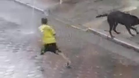 two children playing in the rain