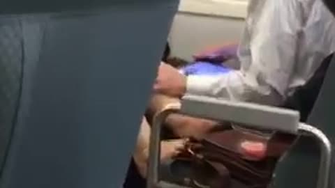 Shoes off feet on subway seat