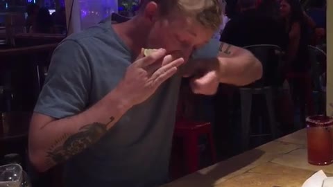 Guy doing a shot up his nose