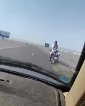 Riding motorcycle backwards in highway