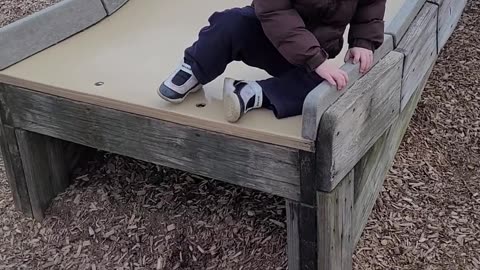 David navigating the slide for the 1st time all by himself