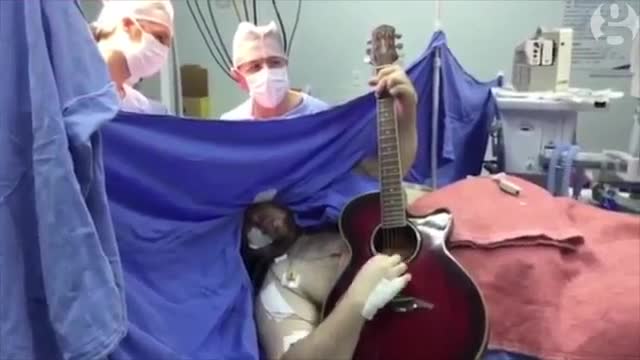 Man plays guitar to remain conscious during brain surgery _ Science news