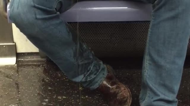Guy throws up on subway train
