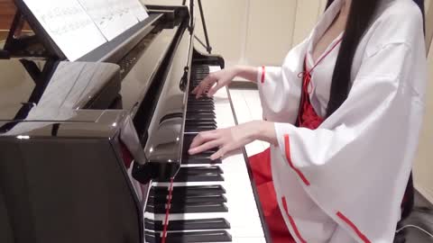 Beautiful woman playing piano while cosplaying