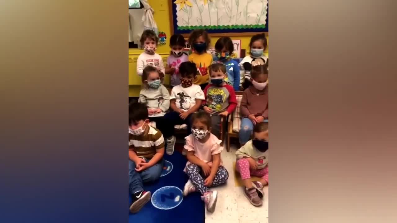 Creepy school teacher singing about masks to children