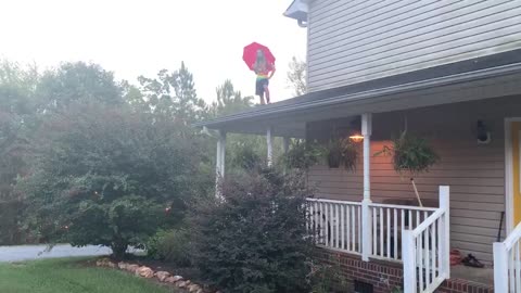 Umbrella Makes Poor Parachute for Roof Jump